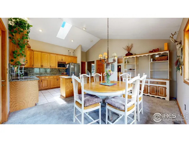a dining room with lots of wooden furniture