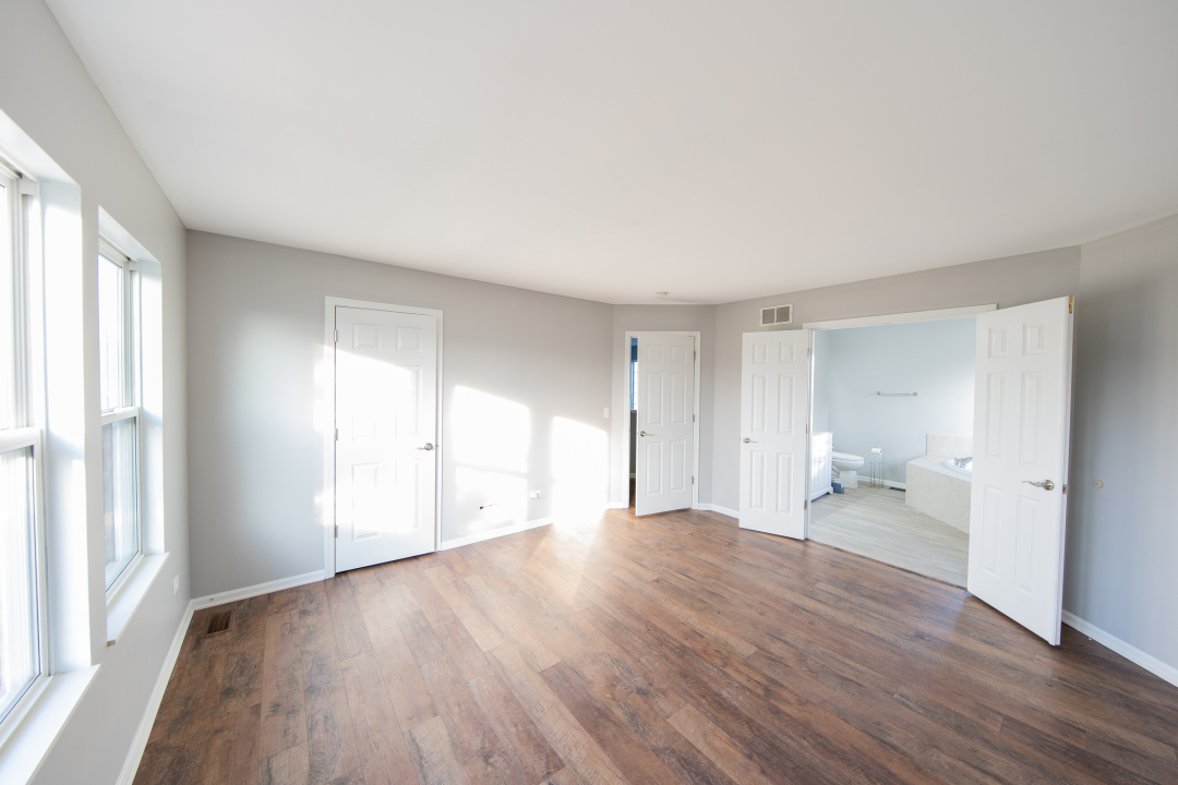 1303 Bridgehampton Drive Plainfield, IL 60586 - Photo 12 of 29 a big room with wooden floor and a window