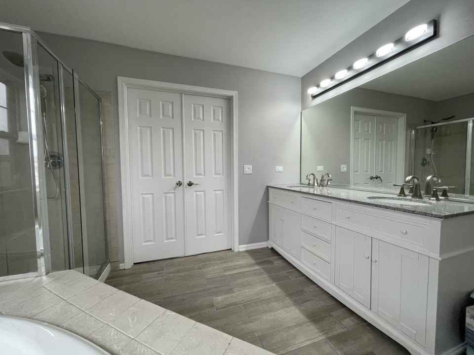 1303 Bridgehampton Drive Plainfield, IL 60586 - Photo 14 of 29 a bathroom with a double vanity sink and a mirror