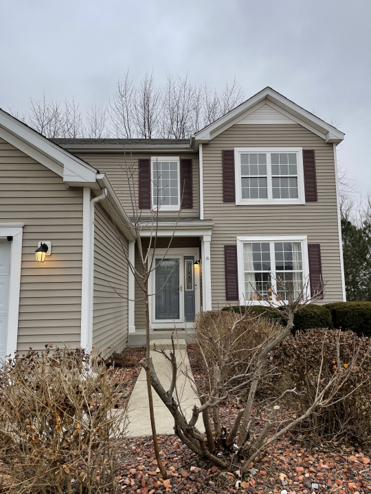 1303 Bridgehampton Drive Plainfield, IL 60586 - Photo 3 of 29 a front view of a house with garden