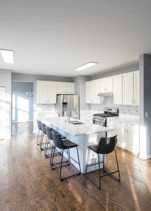 1303 Bridgehampton Drive Plainfield, IL 60586 - Photo 9 of 29 a view of a dining room with furniture window and wooden floor