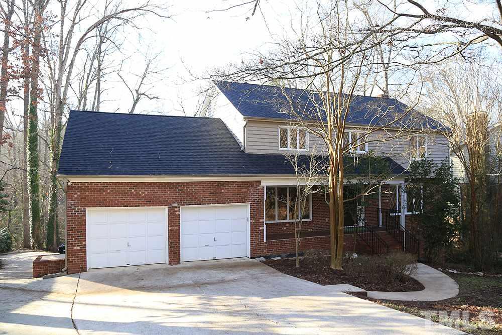 4316 Oak Park Road Raleigh, NC 27612 - Photo 1 of 30 a front view of a house with garage