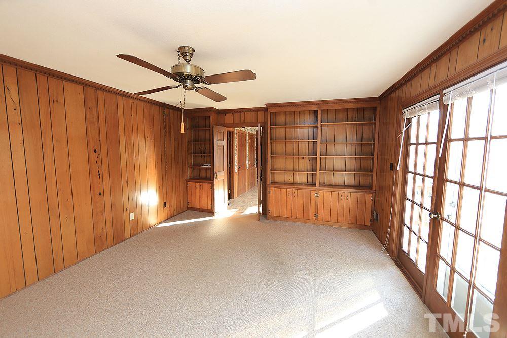 4316 Oak Park Road Raleigh, NC 27612 - Photo 14 of 30 a view of a livingroom with a ceiling fan and window