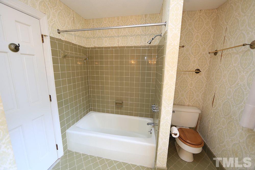 4316 Oak Park Road Raleigh, NC 27612 - Photo 19 of 30 a bathroom with a shower and a toilet