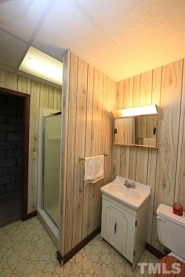 4316 Oak Park Road Raleigh, NC 27612 - Photo 24 of 30 a bathroom with a double vanity sink and mirror