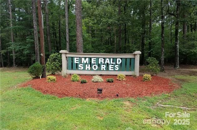 0 Emerald Shores Road, Unit 1 Mount Gilead, NC 27306 - Photo 1 of 1 a sign of golf club on a wall