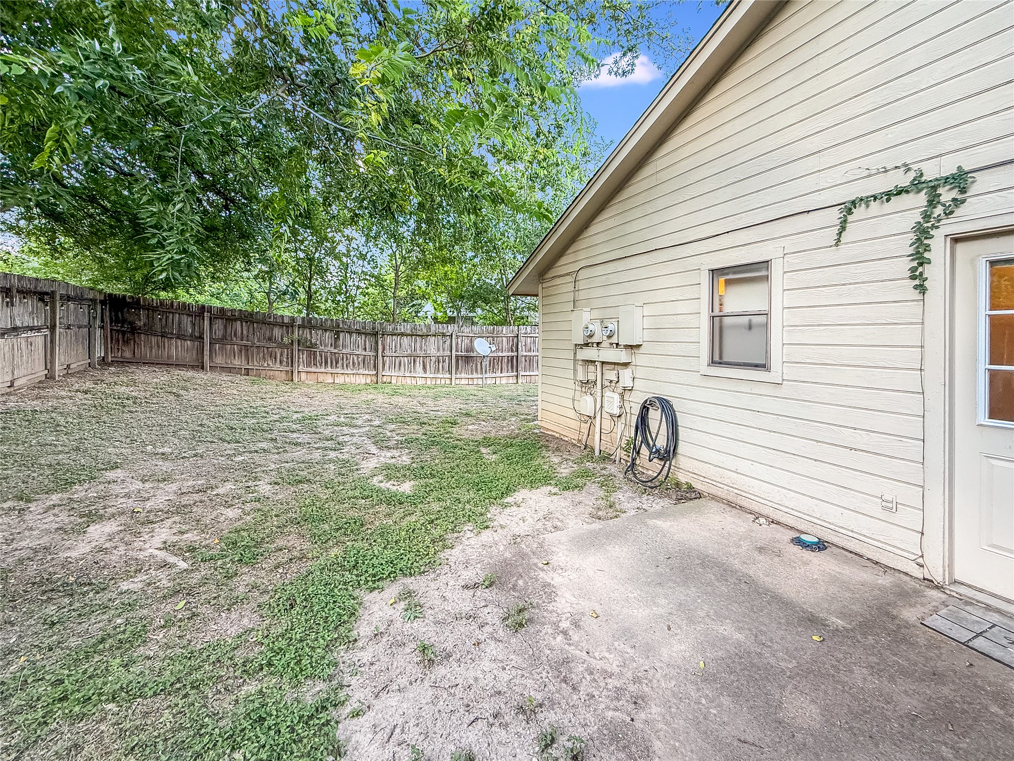 2014 Alex Avenue, Unit B Austin, TX 78728 - Photo 24 of 24 Backyard with a covered Wooden Fence
