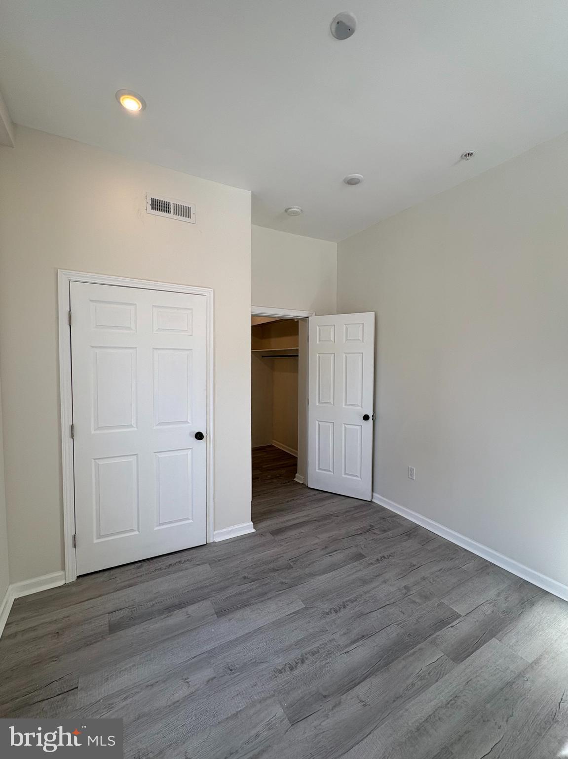 3625 North 22nd Street, Unit 1 Philadelphia, PA 19140 - Photo 8 of 10 a view of an empty room with wooden floor