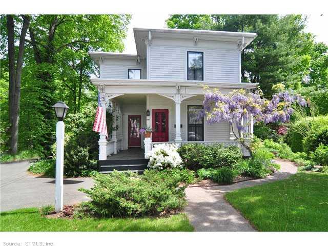 206 Main Street Farmington, CT 06032 - Photo 1 of 1 a front view of a house with garden