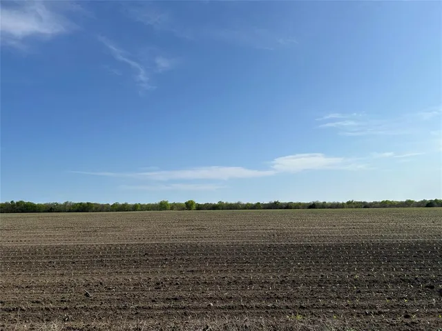 a view of a large body of water with a mountain in the background