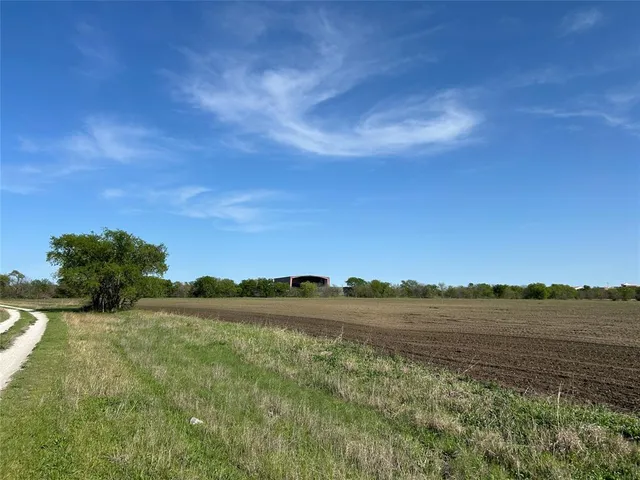 a view of a lake with houses in the background