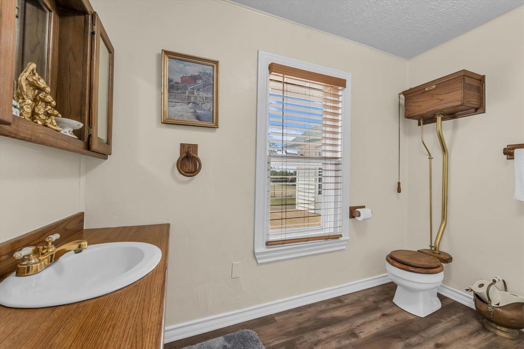 15288 Old China Spring Road China Spring, TX 76633 - Photo 22 of 40 a bathroom with a sink and a toilet
