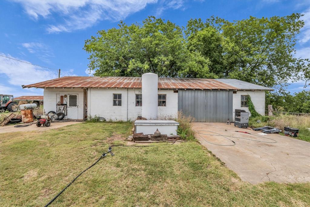 15288 Old China Spring Road China Spring, TX 76633 - Photo 29 of 40 a view of a house with backyard sitting area and garden
