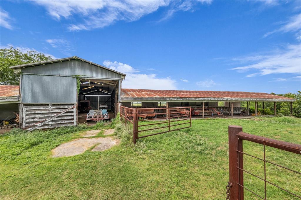 15288 Old China Spring Road China Spring, TX 76633 - Photo 33 of 40 a view of a garden with a bench in a big yard