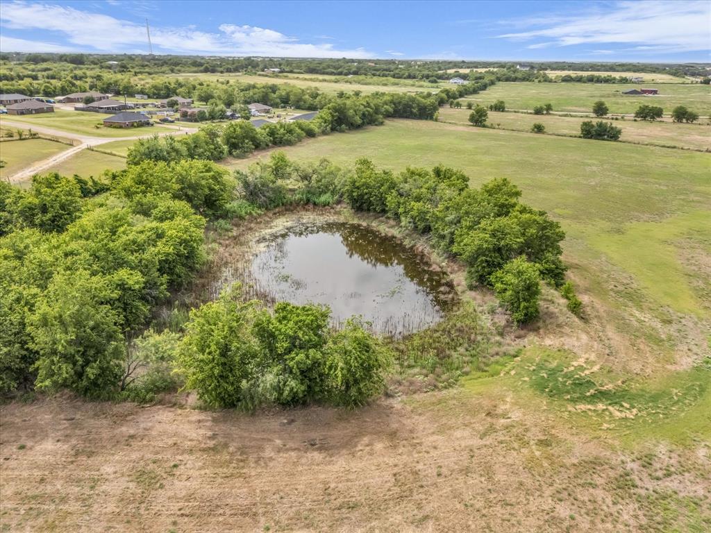 15288 Old China Spring Road China Spring, TX 76633 - Photo 37 of 40 a view of a lake with a mountain in the background