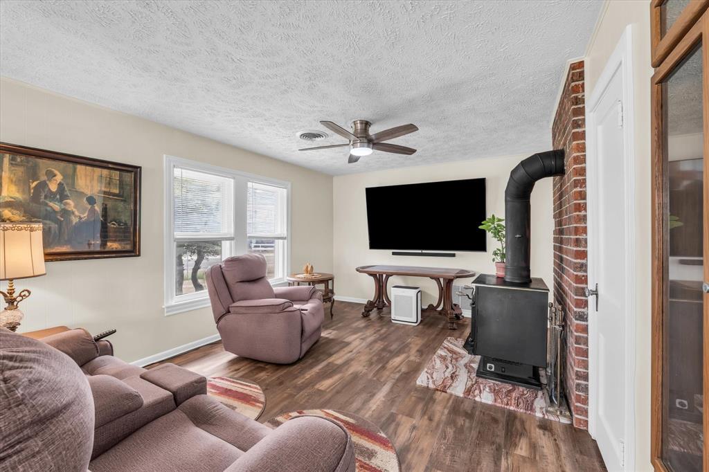 15288 Old China Spring Road China Spring, TX 76633 - Photo 6 of 40 a living room with furniture and a flat screen tv