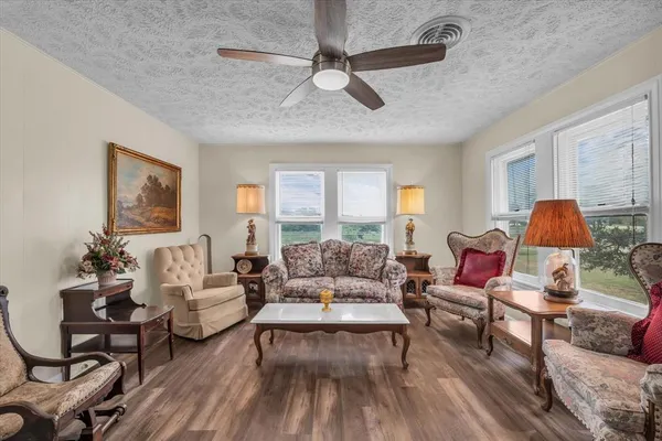 a living room with furniture and a large window