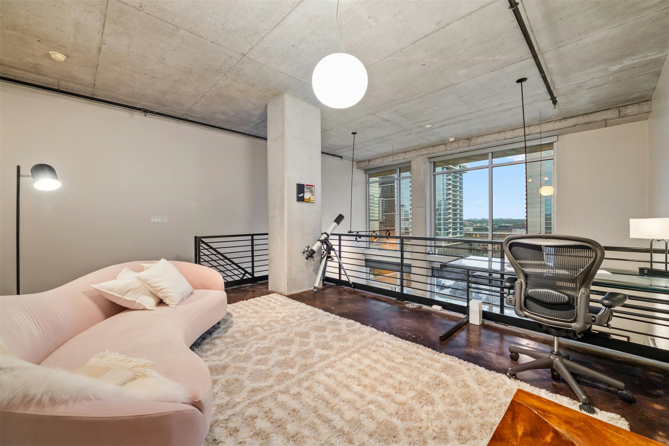 800 West 5th Street, Unit 1104 Austin, TX 78703 - Photo 12 of 31 a bedroom with furniture and a flat screen tv
