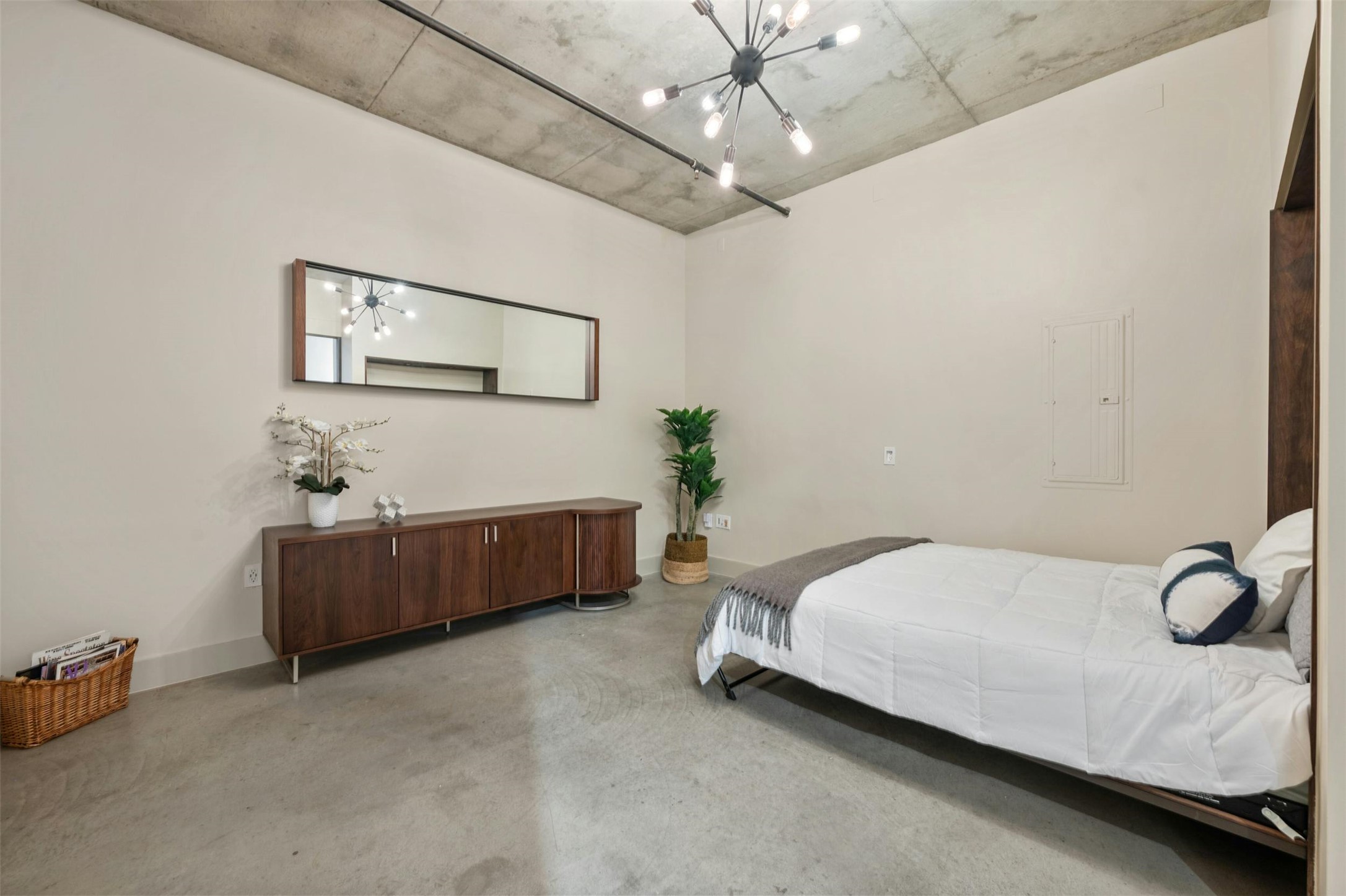 800 West 5th Street, Unit 1104 Austin, TX 78703 - Photo 23 of 31 a spacious bedroom with a bed and a table
