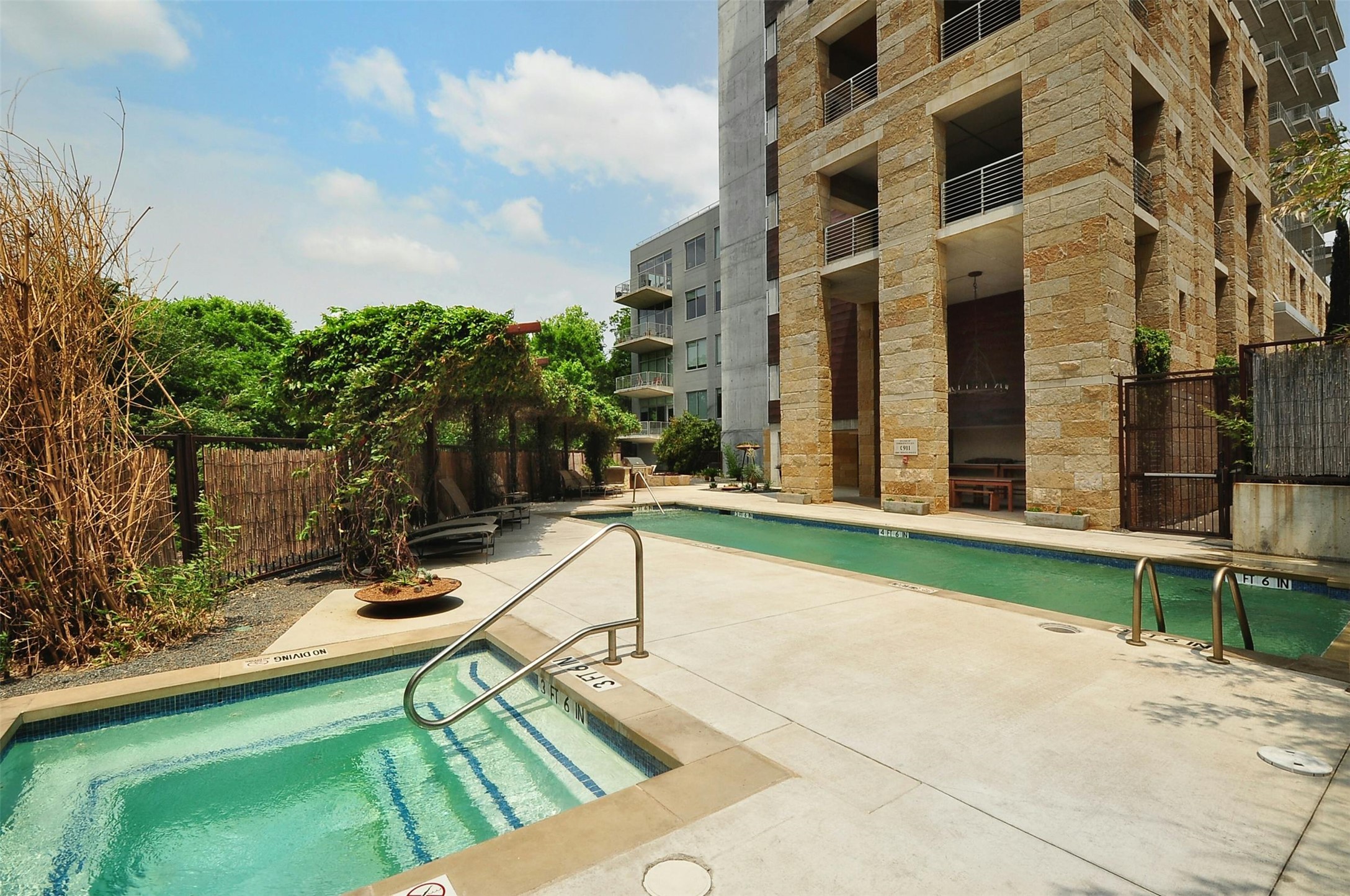 800 West 5th Street, Unit 1104 Austin, TX 78703 - Photo 28 of 31 a swimming pool with outdoor seating and yard