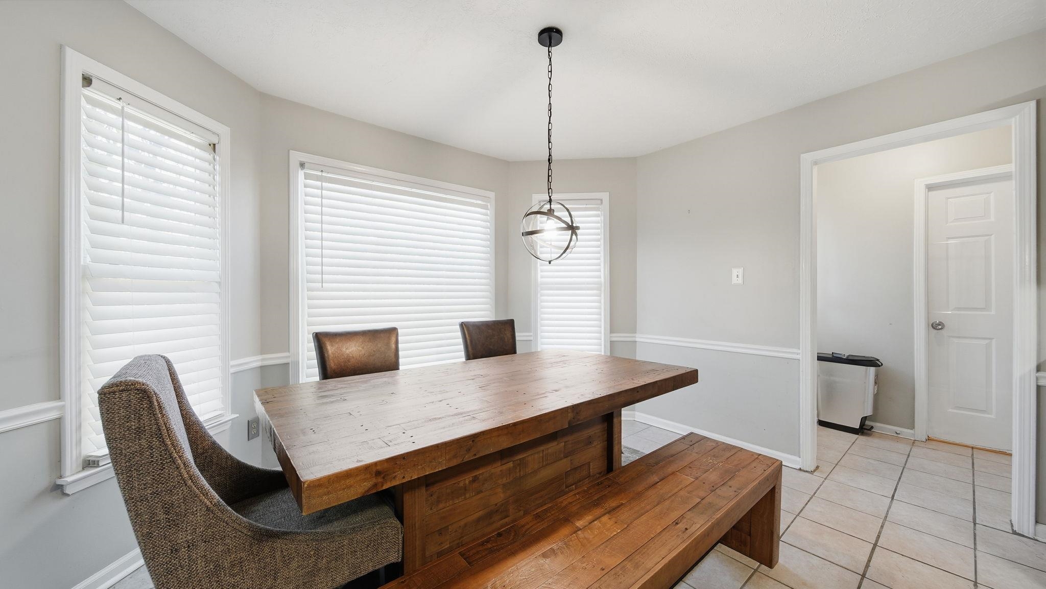 1785 Candle Ridge Drive Cordova, TN 38016 - Photo 14 of 39 a view of a dining room with a table and chairs