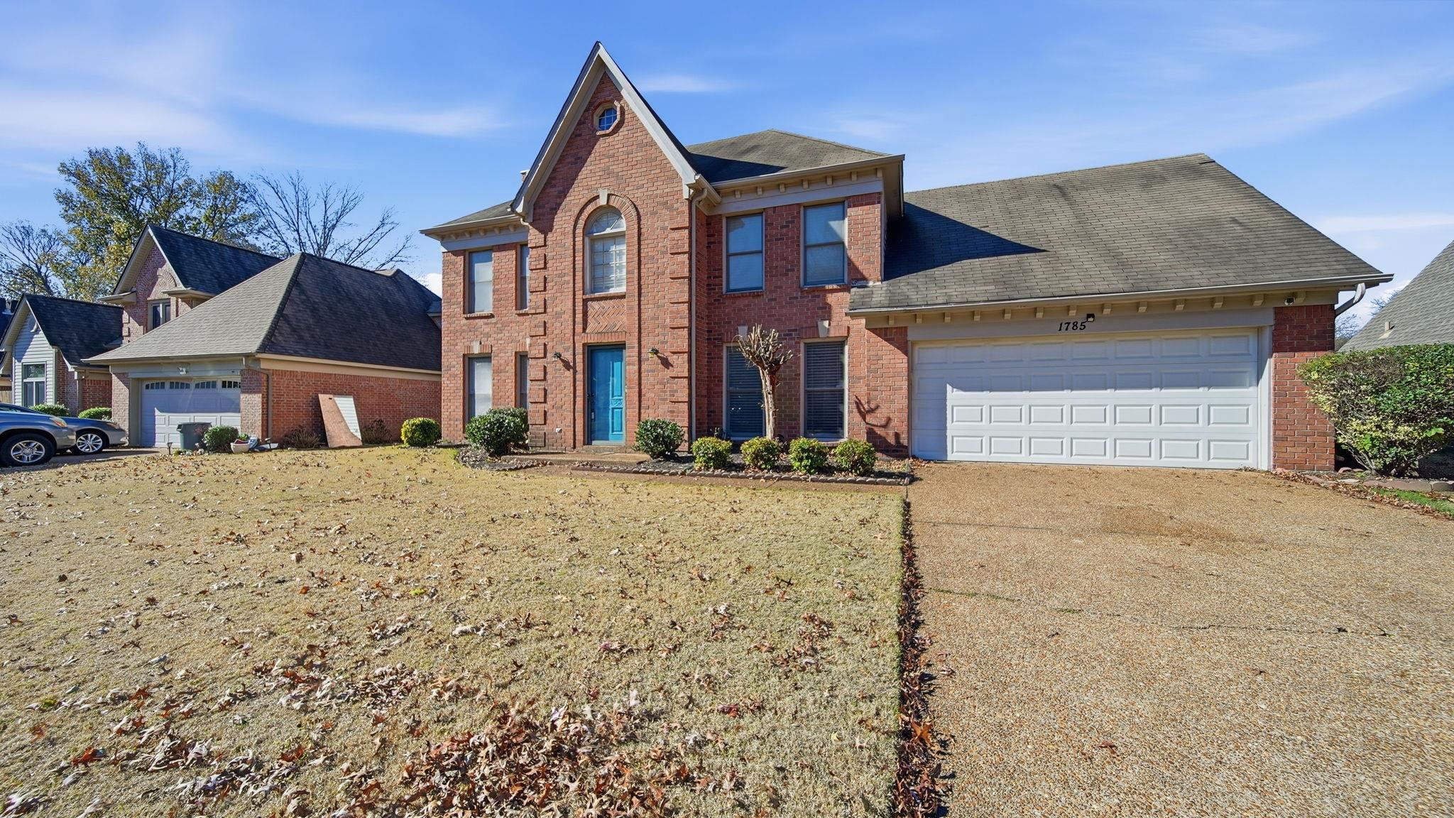 1785 Candle Ridge Drive Cordova, TN 38016 - Photo 2 of 39 View of front of property featuring brick siding, concrete driveway, a front lawn, and an attached garage
