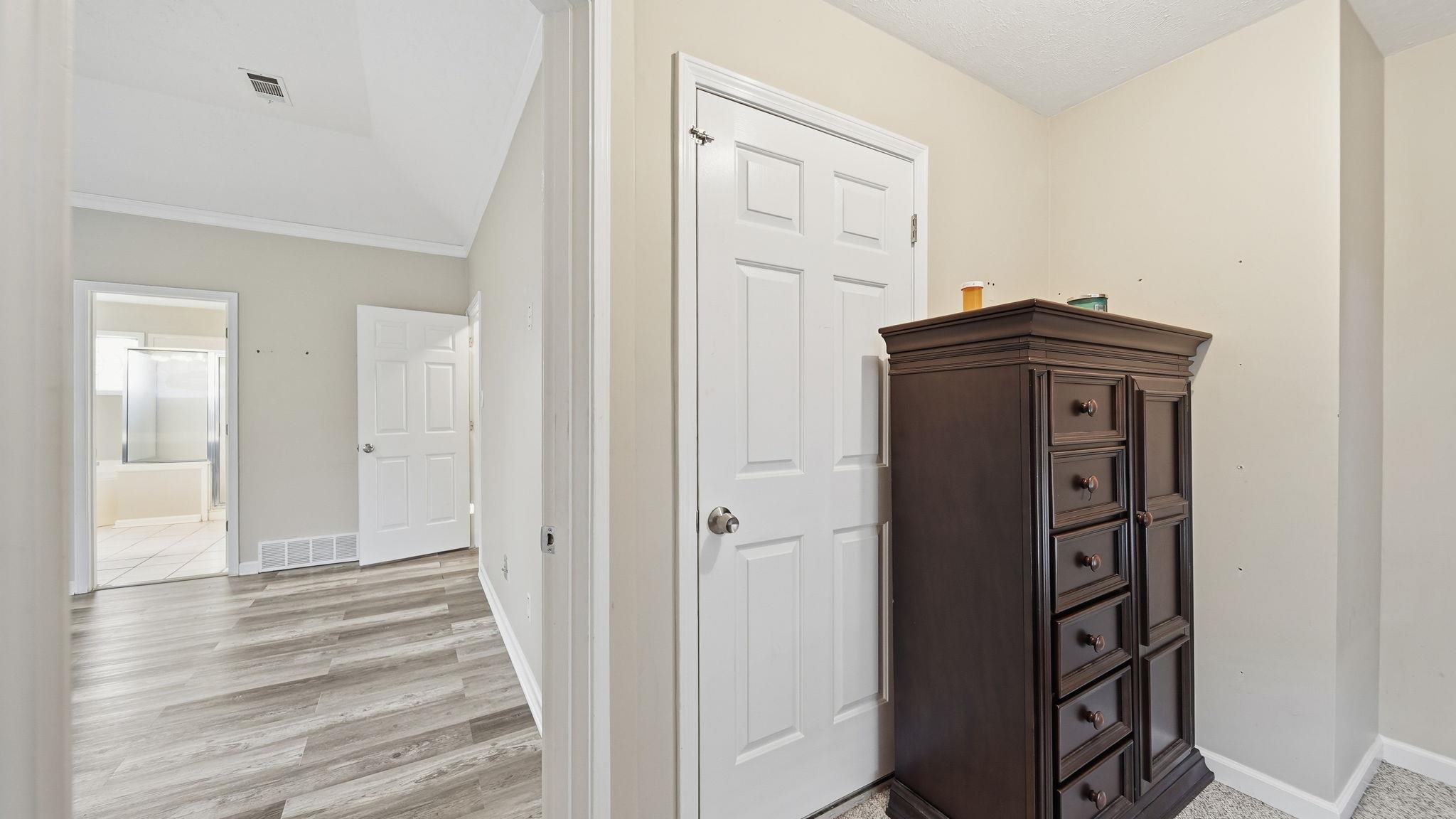 1785 Candle Ridge Drive Cordova, TN 38016 - Photo 29 of 39 a view of a hallway with wooden floor and closet