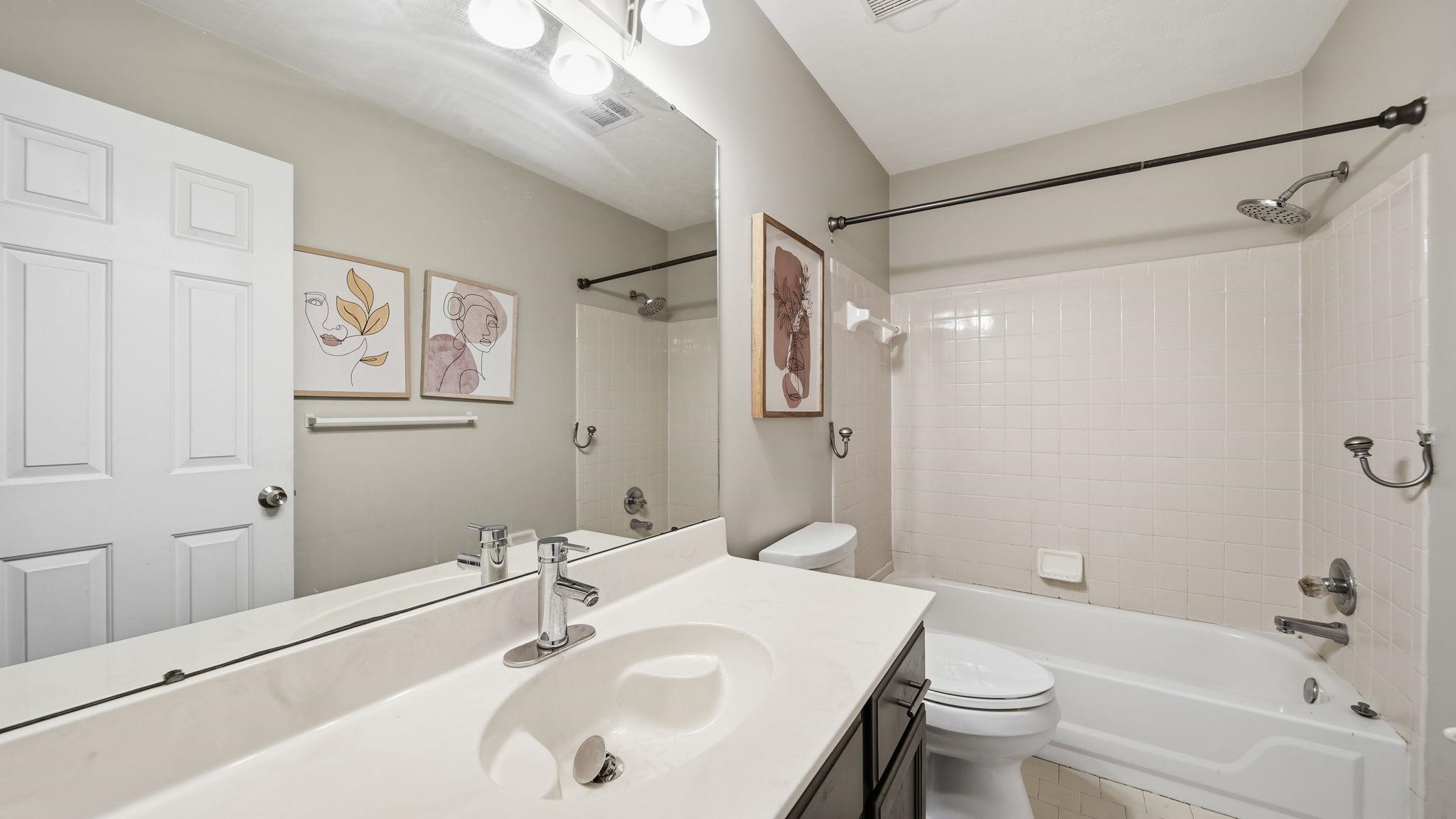 1785 Candle Ridge Drive Cordova, TN 38016 - Photo 32 of 40 a bathroom with a sink toilet and shower