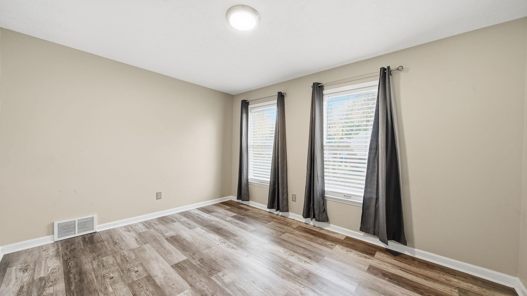 1785 Candle Ridge Drive Cordova, TN 38016 - Photo 32 of 39 Unfurnished room featuring light wood-type flooring and baseboards