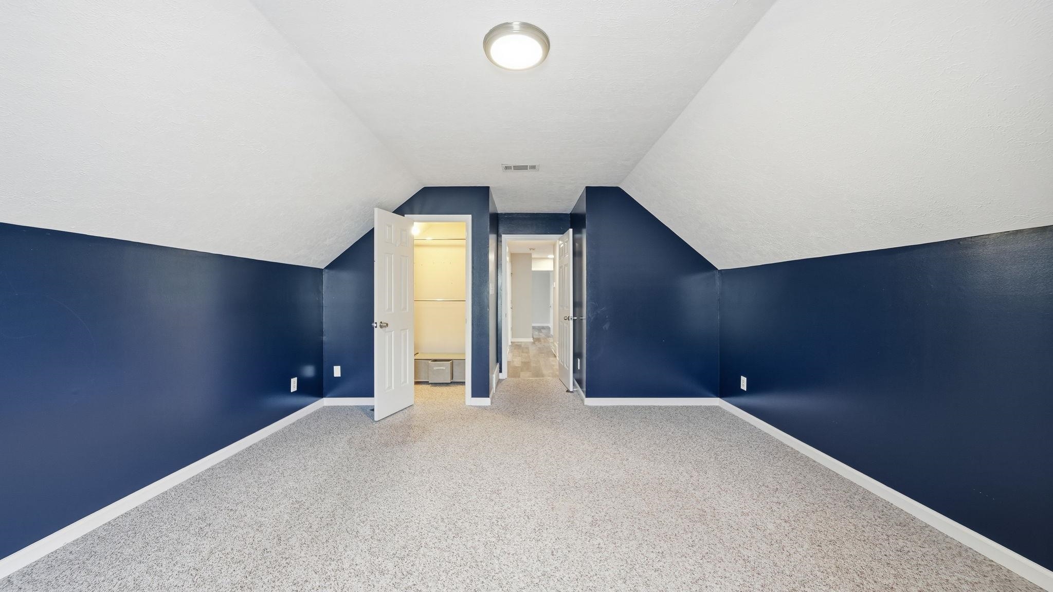 1785 Candle Ridge Drive Cordova, TN 38016 - Photo 35 of 39 Bonus room with vaulted ceiling and carpet floors