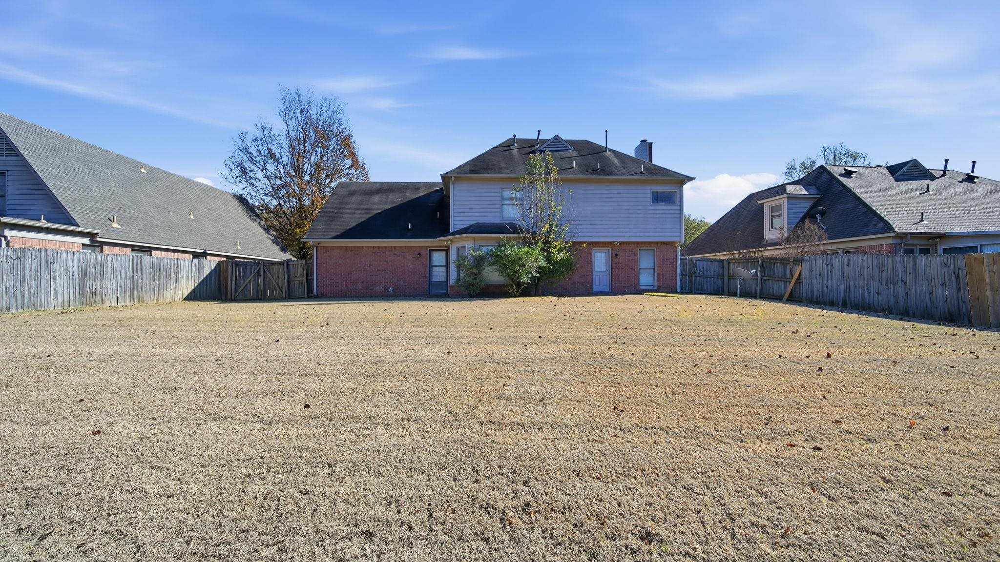1785 Candle Ridge Drive Cordova, TN 38016 - Photo 37 of 39 Back of house featuring brick siding and a fenced backyard