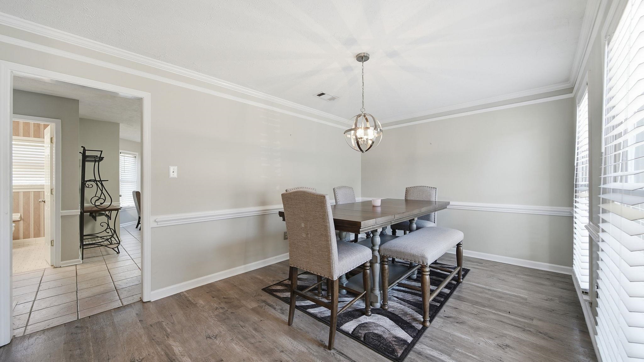 1785 Candle Ridge Drive Cordova, TN 38016 - Photo 8 of 40 a workspace with wooden floor and a window