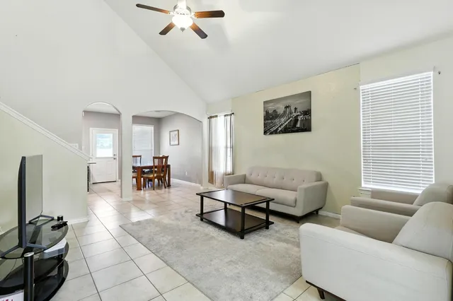a living room with furniture and a window