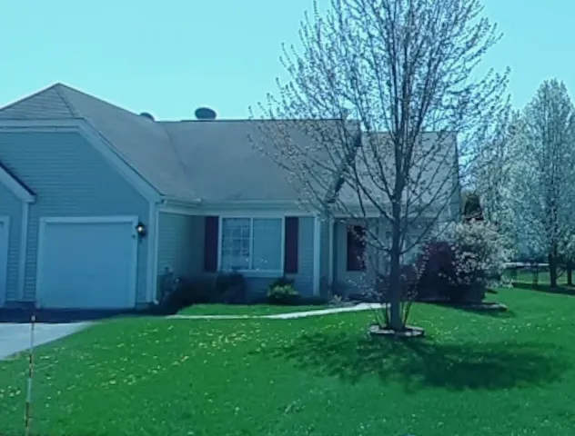 a house view with a garden space