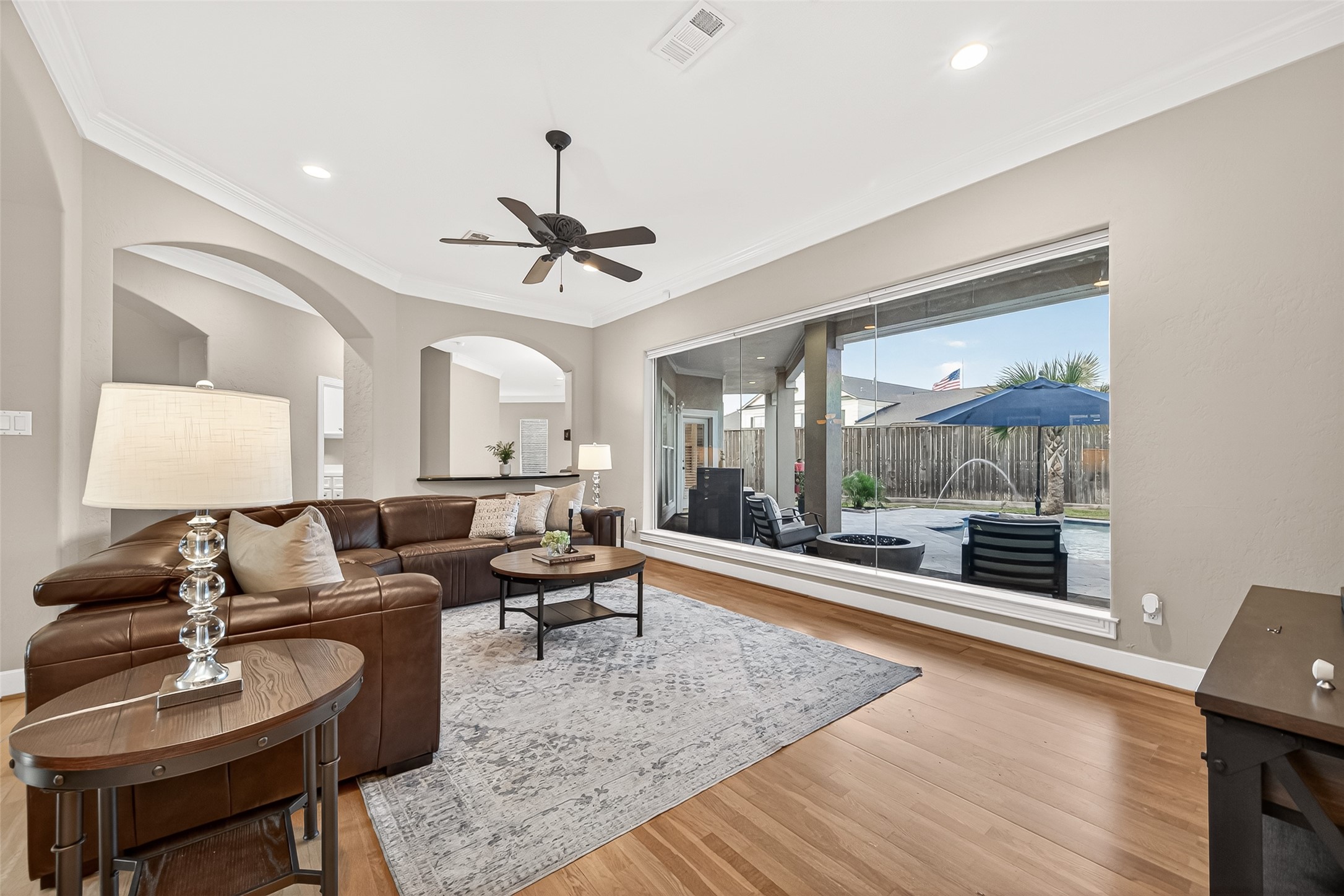 22 Stonegate Park Court Spring, TX 77379 - Photo 5 of 49 Alternative view of the formal living room with floor to ceiling windows and a panoramic view of the backyard.