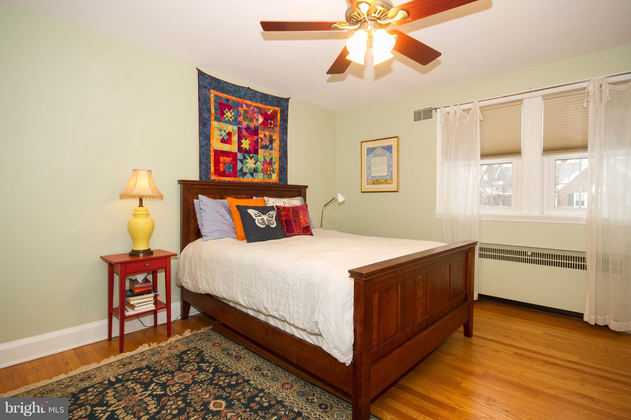 326 Murdock Road Baltimore, MD 21212 - Photo 14 of 29 a bedroom with a bed and a chandelier