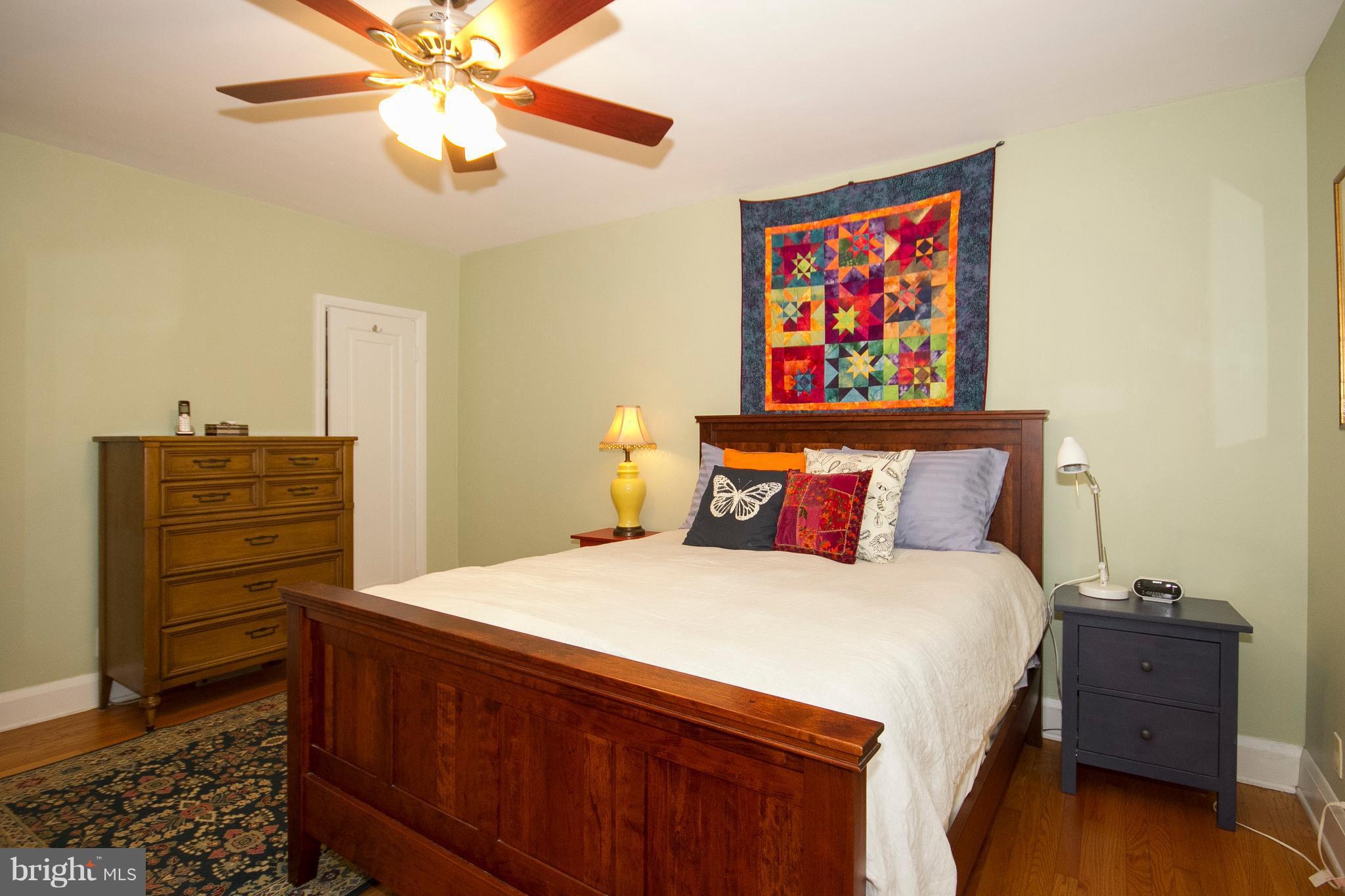 326 Murdock Road Baltimore, MD 21212 - Photo 15 of 29 a bedroom with a bed and a chandelier