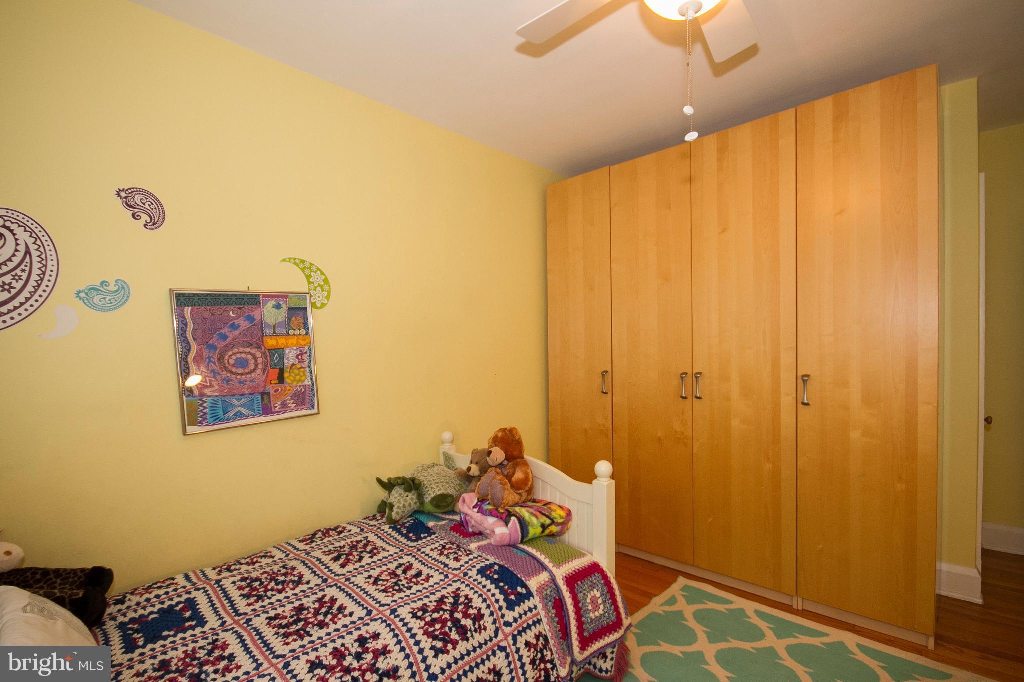 326 Murdock Road Baltimore, MD 21212 - Photo 17 of 29 a bedroom with a bed and a painting on the wall