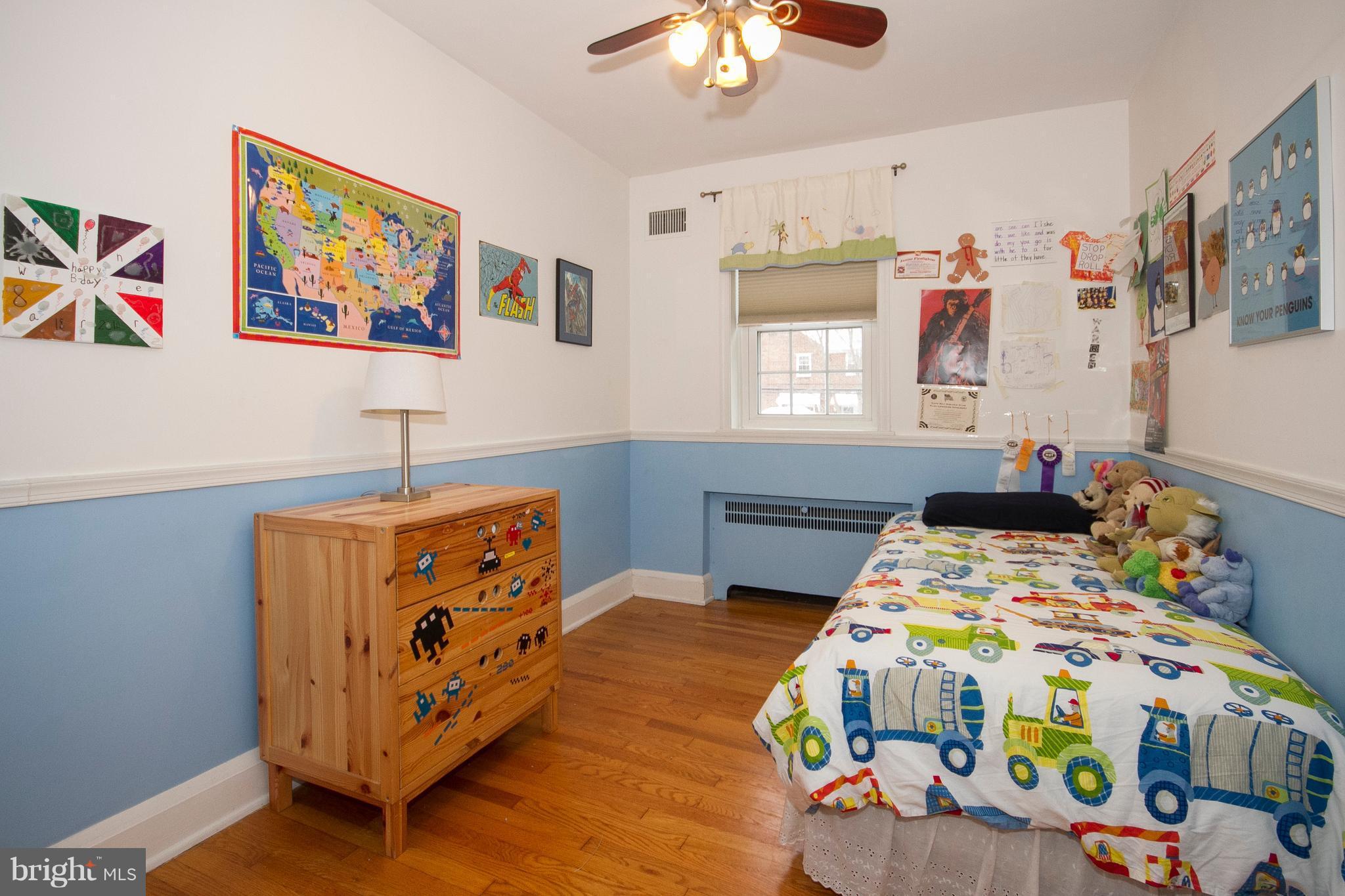 326 Murdock Road Baltimore, MD 21212 - Photo 18 of 29 a bedroom with bed and a baby crib