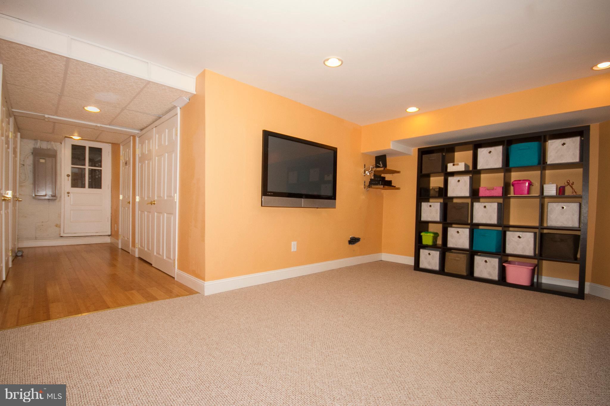 326 Murdock Road Baltimore, MD 21212 - Photo 22 of 29 a view of an empty room with window and a flat screen tv