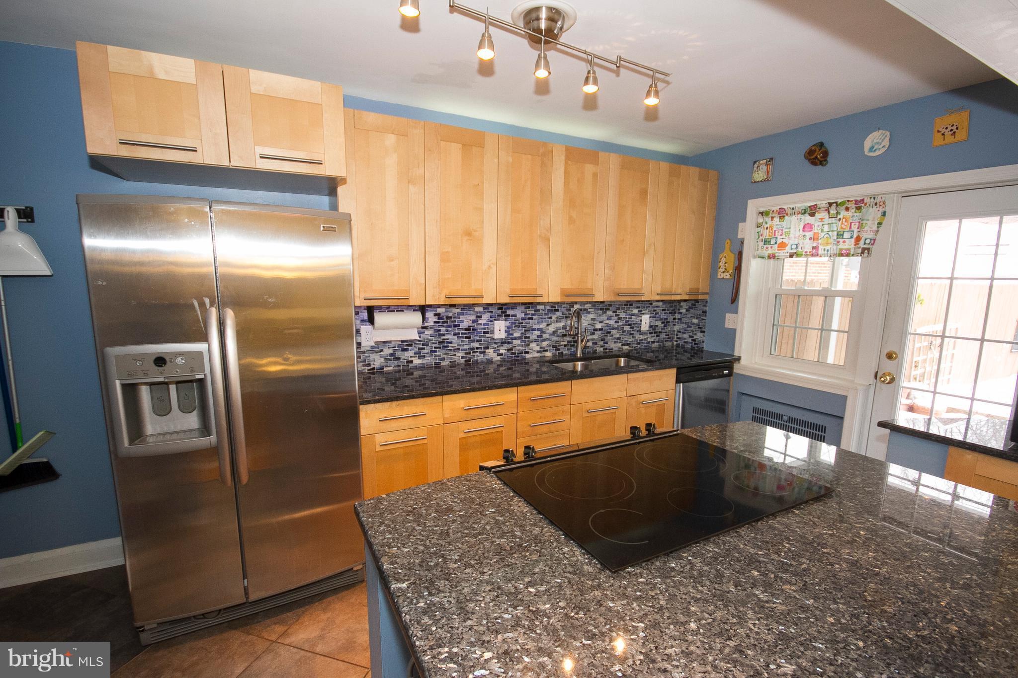 326 Murdock Road Baltimore, MD 21212 - Photo 6 of 29 a large kitchen with stainless steel appliances granite countertop a refrigerator and a sink