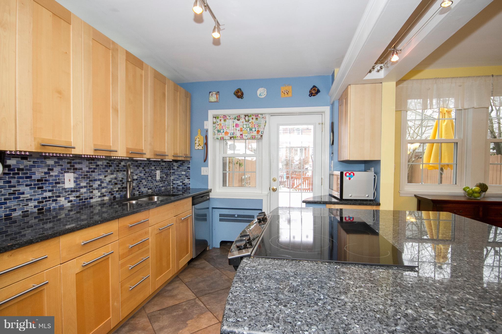 326 Murdock Road Baltimore, MD 21212 - Photo 7 of 29 a large kitchen with kitchen island granite countertop a large window