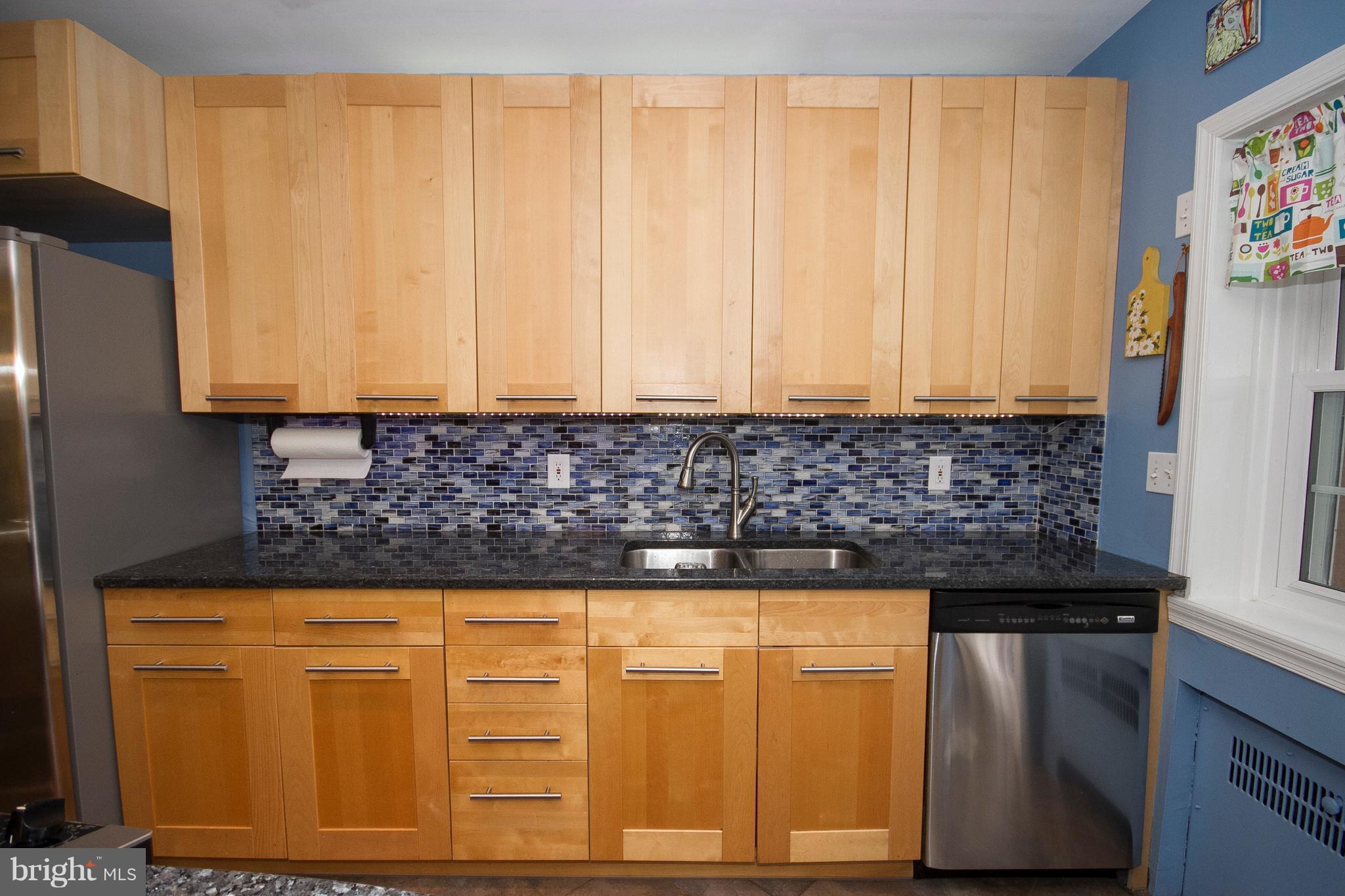 326 Murdock Road Baltimore, MD 21212 - Photo 9 of 29 a kitchen with granite countertop cabinets and black stainless steel appliances