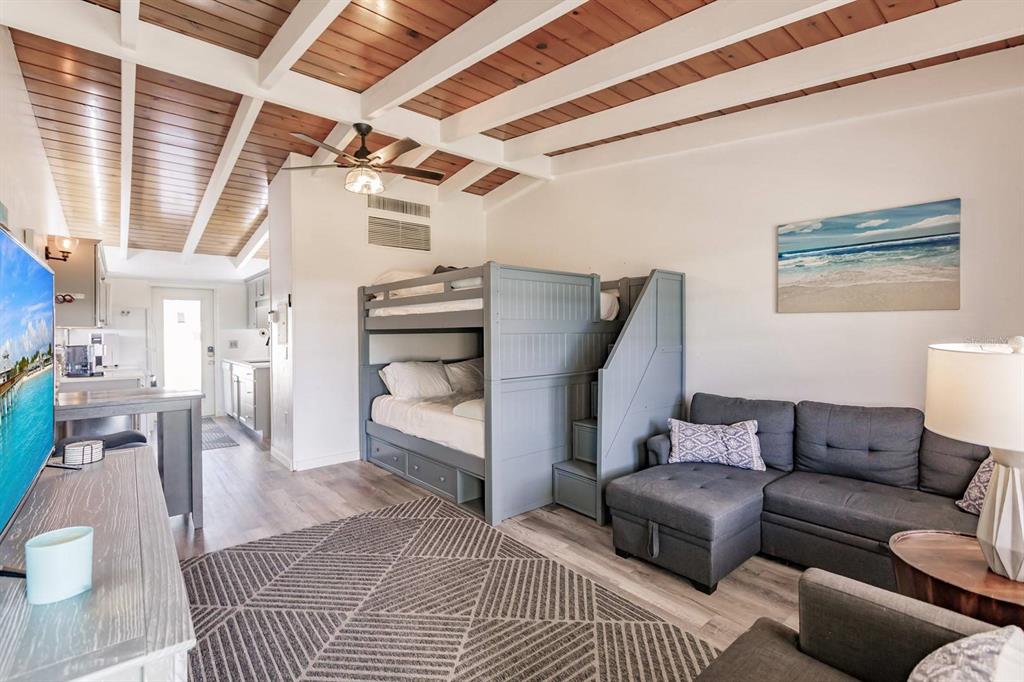 6006 Midnight Pass Road, Unit 2 Sarasota, FL 34242 - Photo 2 of 15 a living room with furniture and a window