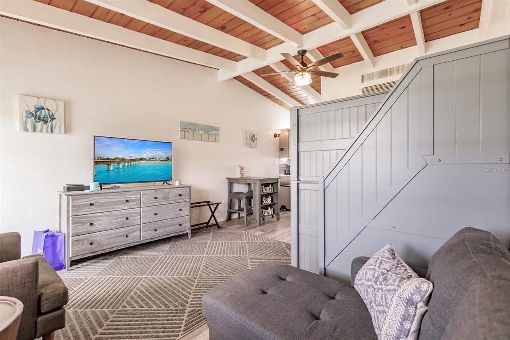 6006 Midnight Pass Road, Unit 2 Sarasota, FL 34242 - Photo 3 of 15 a bedroom with furniture and a window