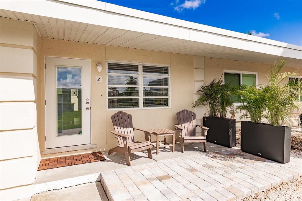 6006 Midnight Pass Road, Unit 2 Sarasota, FL 34242 - Photo 9 of 15 a view of a house with sitting area and furniture