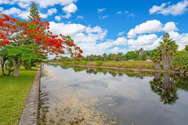 a view of a lake with a yard
