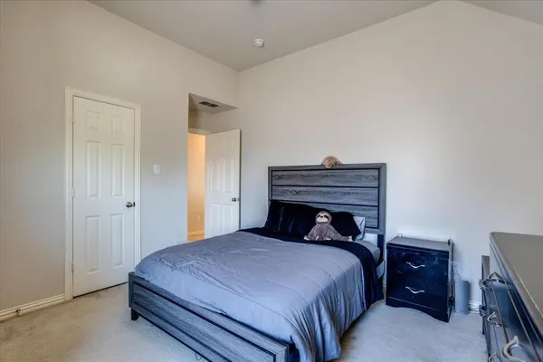 a bedroom with a bed and a closet