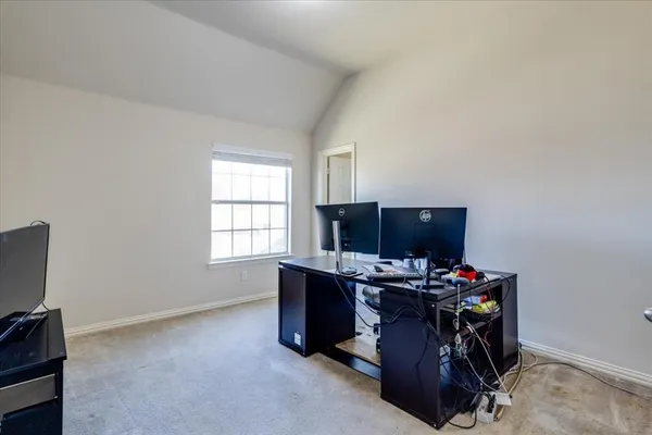 a view of workspace with furniture and window