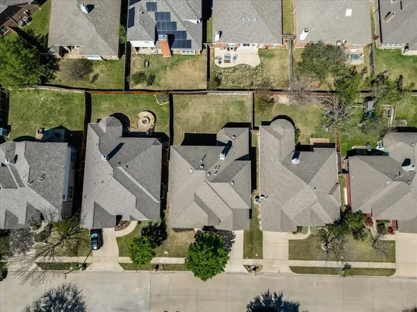 an aerial view of a house with outdoor space
